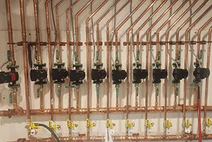 Copper piping and circulation pumps for a hydronic heating system